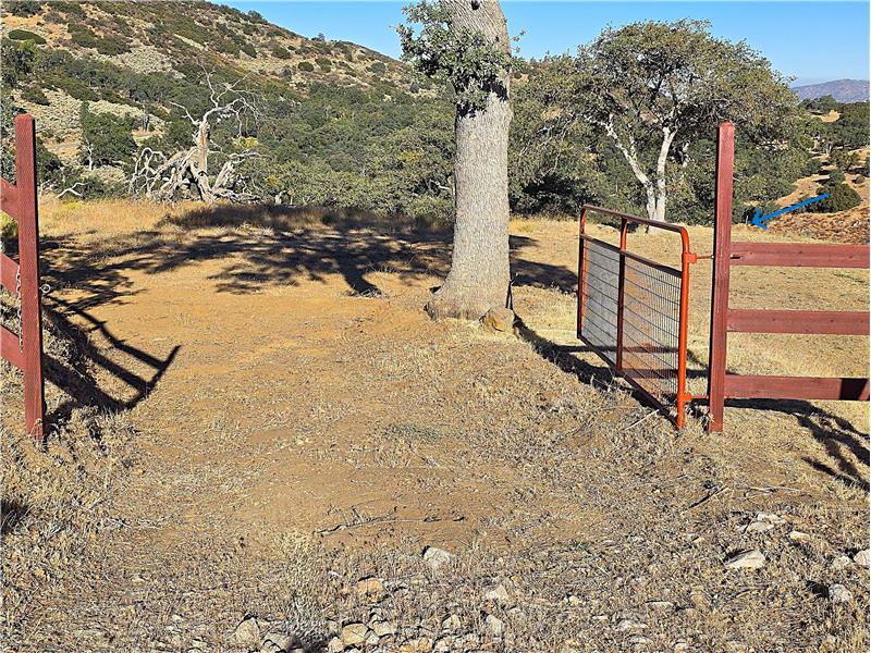 Fortunate for you, the major expense of the grading to access this pie-shaped lot has already been paid!