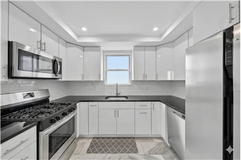 Newly Updated Kitchen with access to private deck and backyard