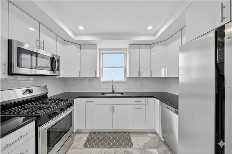 Newly Updated Kitchen with access to private deck and backyard