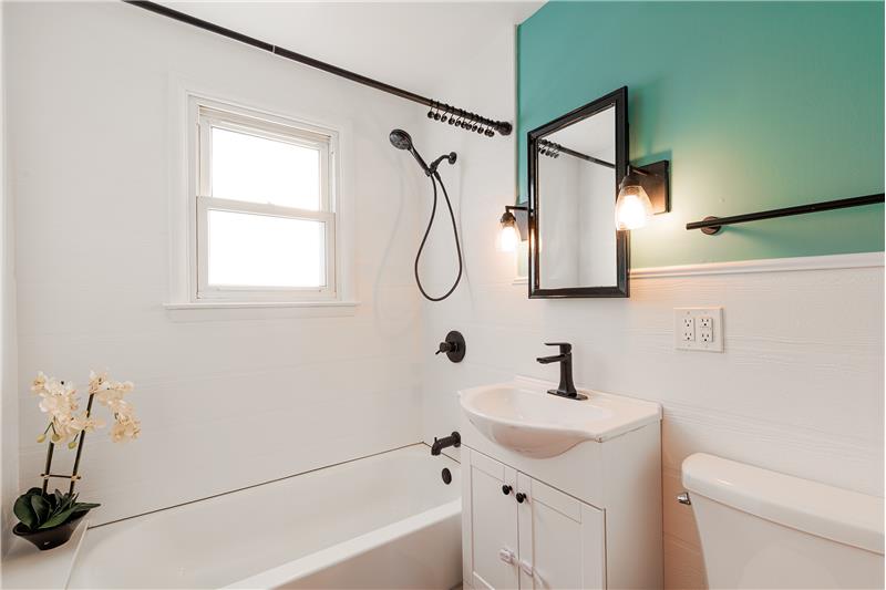 Upgraded main floor bathroom with tub shower