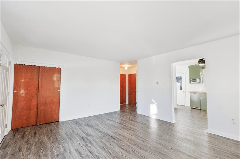 Living room has easy access to kitchen and bath