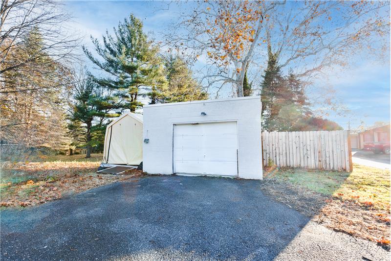 Detached garage and portable storage shed