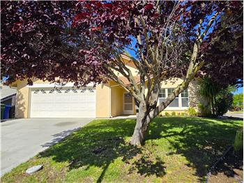 Some corner lot homes make a first impression. Others make you slow down as you drive by. This one does both.