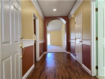 A clean, gallery style entry that sets the tone for contemporary living.