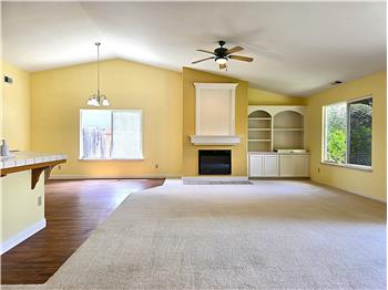Expansive great room with natural light and a calm, modern aesthetic.