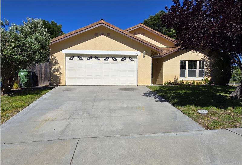 The expansive driveway offers exceptional convenience for guests, gatherings, and everyday parking needs alike.