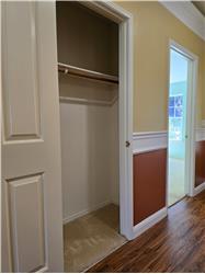That's when you notice the coat closet goes extra deep...both ways!