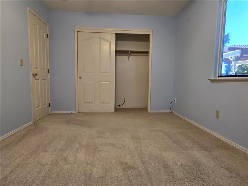 Tucked quietly in the back corner of home, the 3rd Bedroom offers a peaceful & comfortable retreat away from the main living.