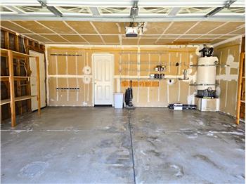 The oversized garage layout comfortably accommodates full-size vehicles while still allowing room for storage & workspace flex!