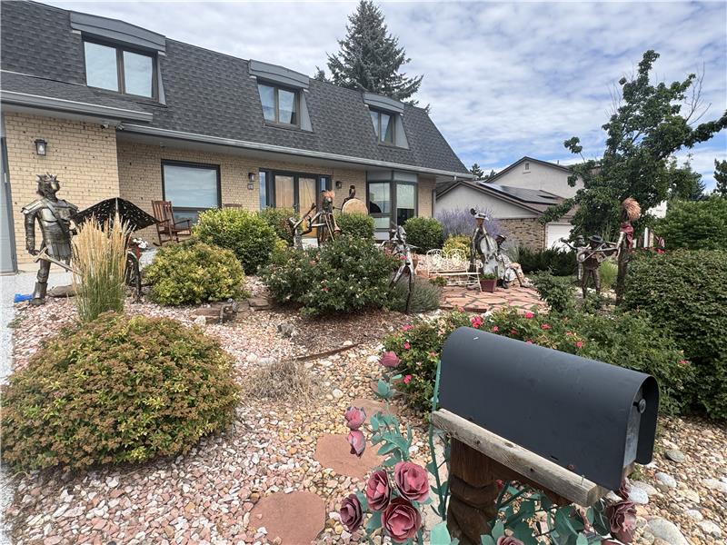 Neighbor's house has sculpture garden in front yard