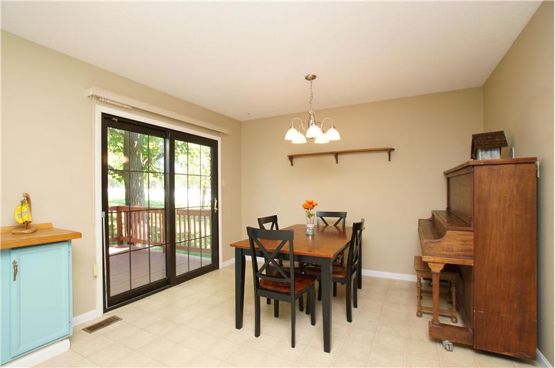 Eat in kitchen dining area with door to deck