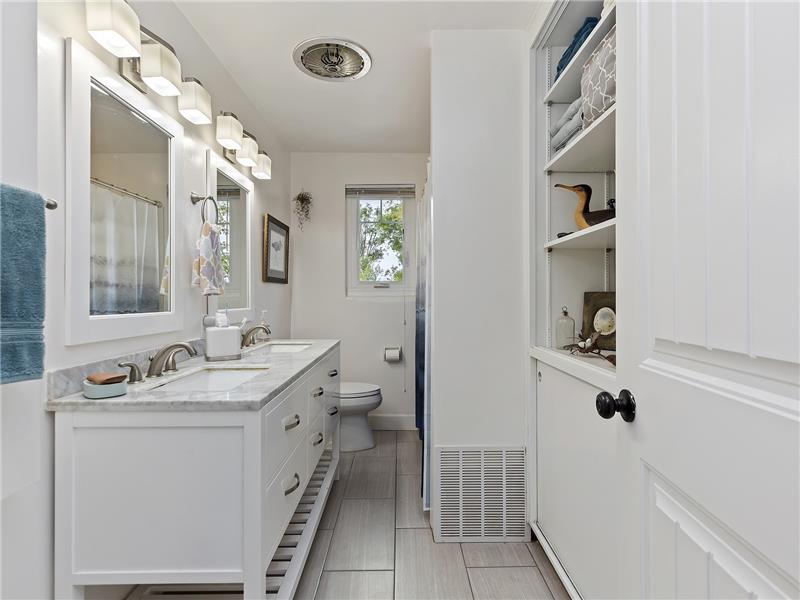 Guest full bath with dual sinks and tub/shower