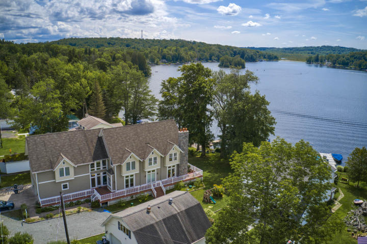 Aerial View of House and Lake