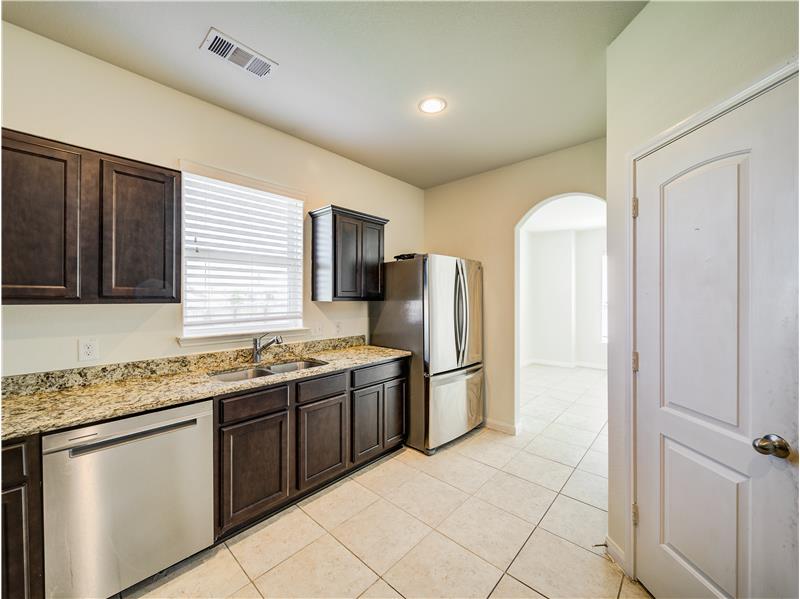 Gourmet kitchen with granite countertops and stainless steel appliances