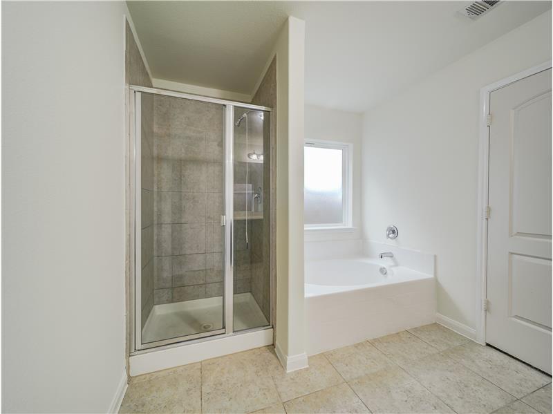Soaking tub and separate shower in primary bath
