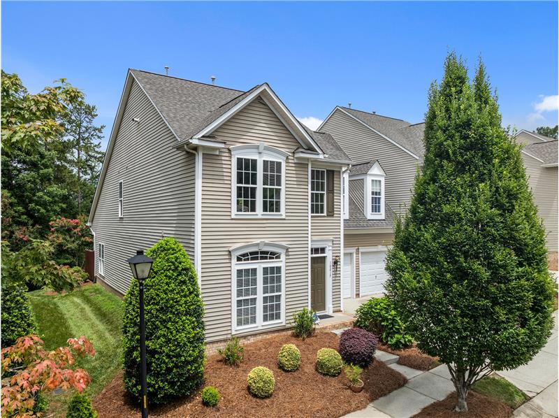 Rarely available end unit provides light and privacy