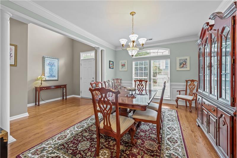 Foyer and dining room with generous millwork