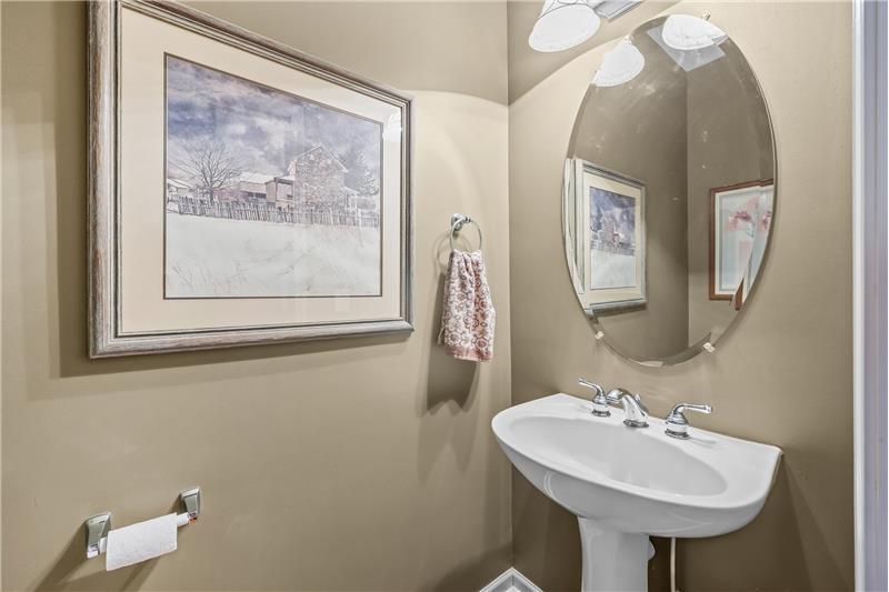 Half bath on main floor with pedestal sink