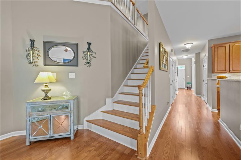 Stairs with wood treads lead to second floor