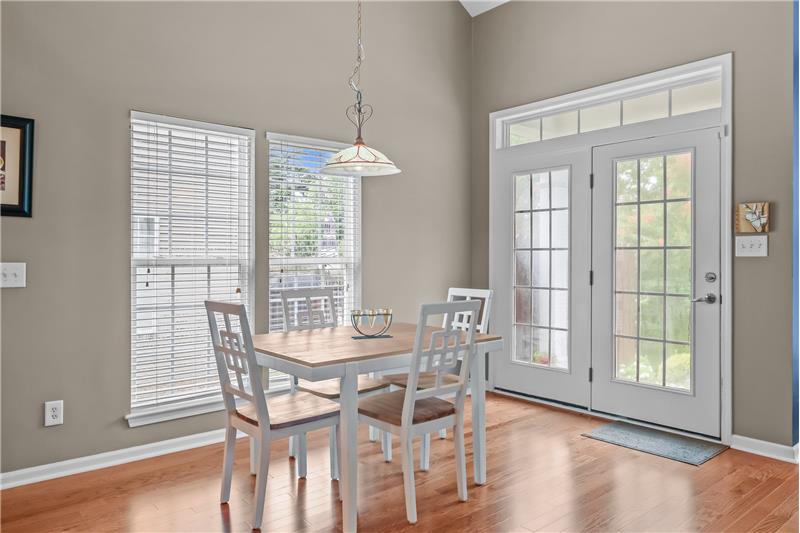 Sunlit breakfast area comfortably seats 6-8; great for daily meals and casual entertaining