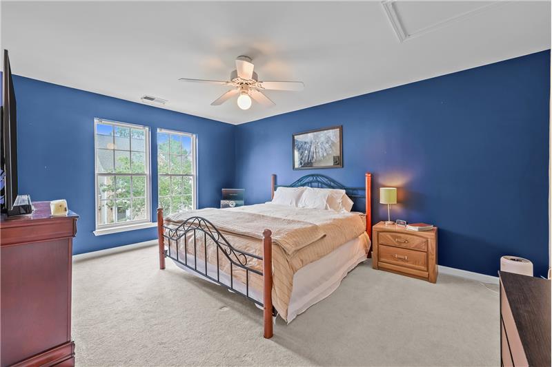 One of two additional large bedrooms on second floor features walk-in closet