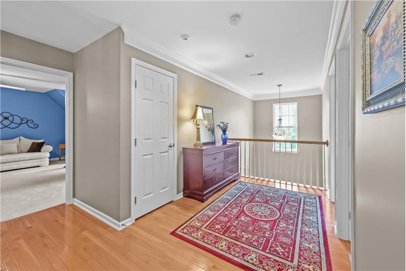 Second floor loft area overlooking home's foyer