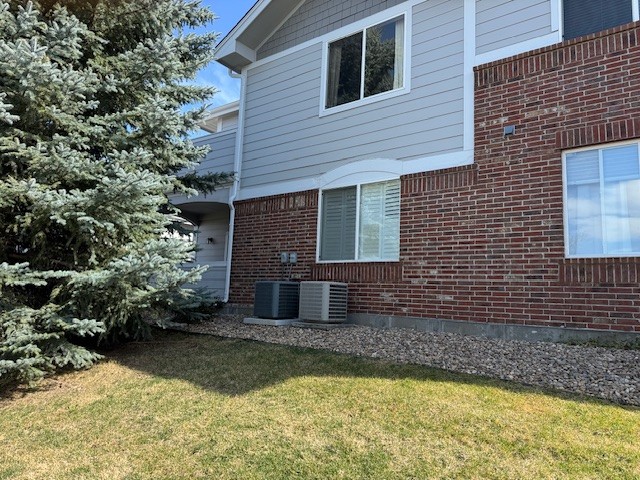 Back of building -  bedroom window and patio visible