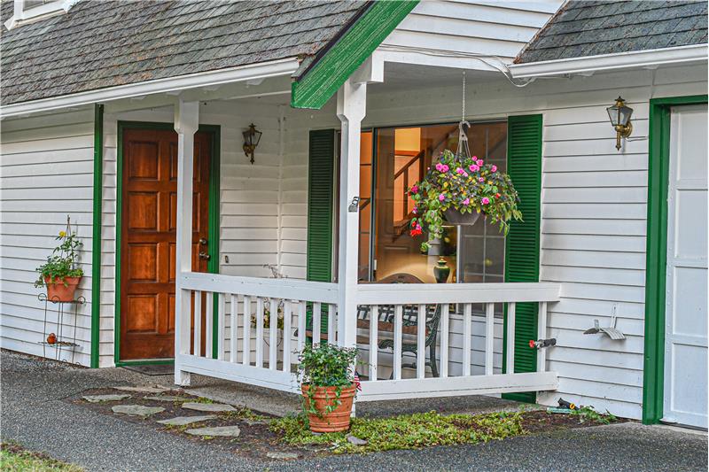 Covered front porch with main entry.
