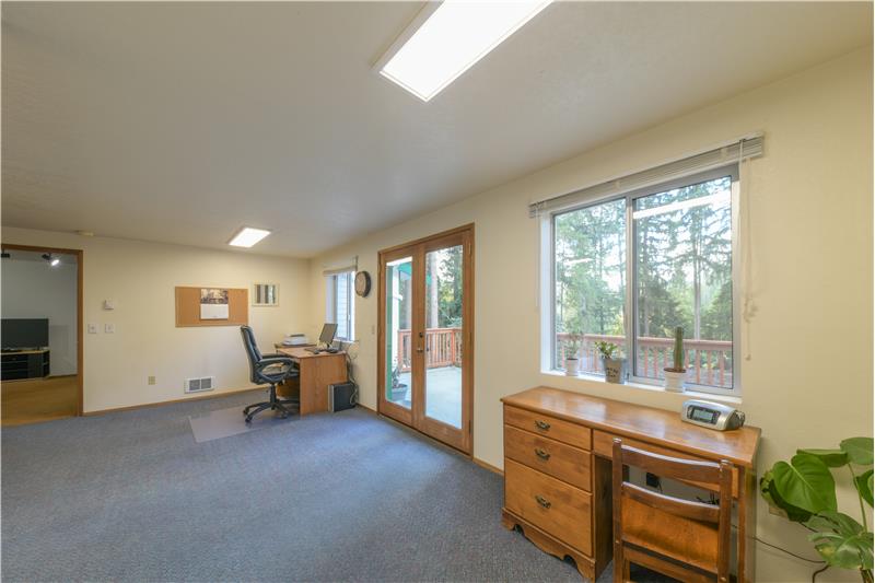 Upstairs office with room for three desks. Separate entry on deck from outside stairwell.