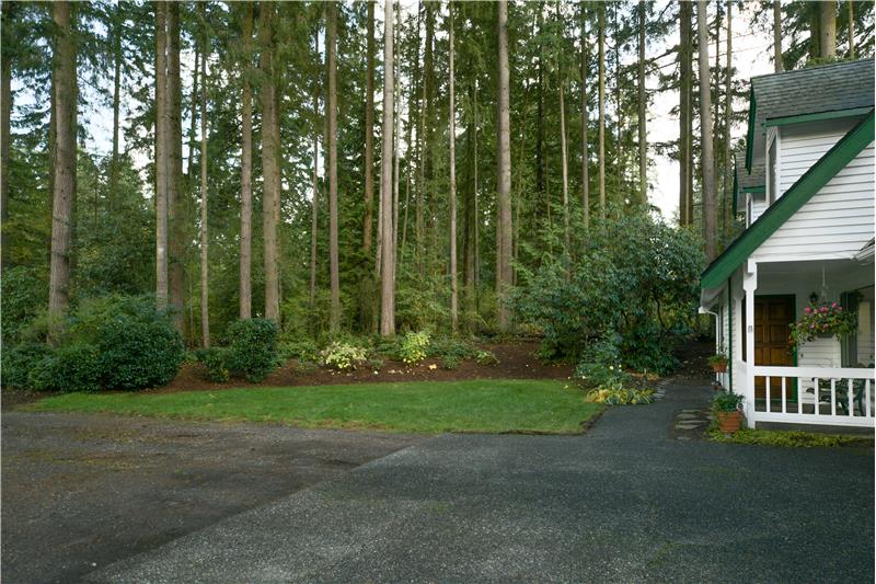 Front yard with landscaped privacy berm.
