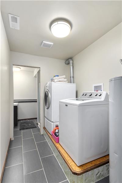 Laundry area is next to Rec Room.  There is a three quarter bath towards the back of this space.