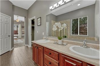 View into the Primary Bedroom from the Primary Bathroom.