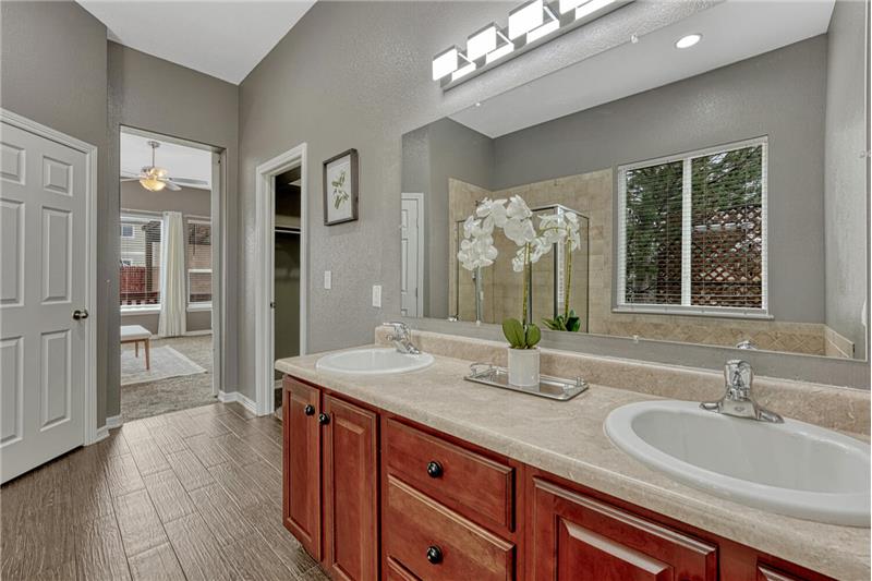 View into the Primary Bedroom from the Primary Bathroom.