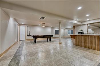 Basement Family Recreation Room with game area and wet bar/kitchenette.