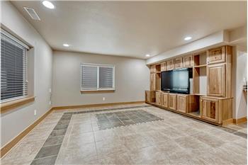 Family Rec Room with built-in wall of cabinetry and TV stand.