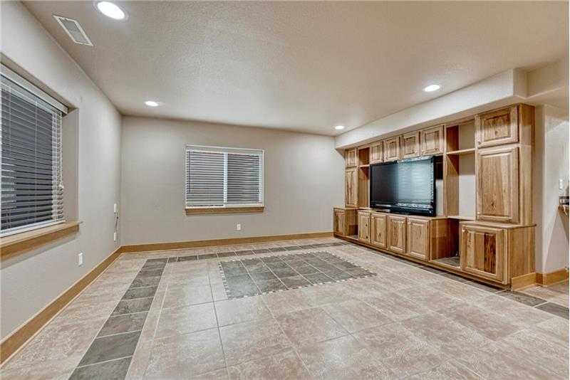 Family Rec Room with built-in wall of cabinetry and TV stand.