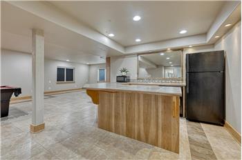 Basement wet bar/kitchenette, great for serving up your favorite drinks or snacks.