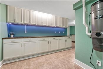 Basement Flex Room with upper and lower cabinets. Central Vac location.