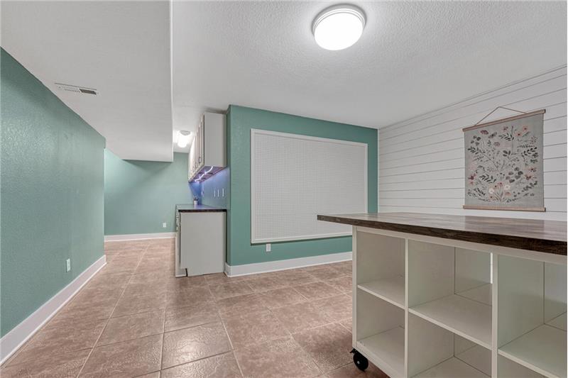 Basement Flex Room designed for many uses such as a craft room, play room, pantry, or study.