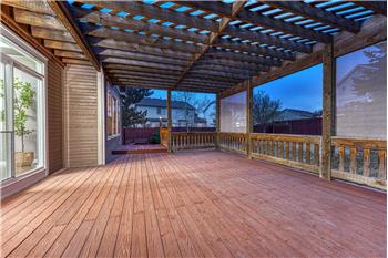 Backyard deck with covered pergola.