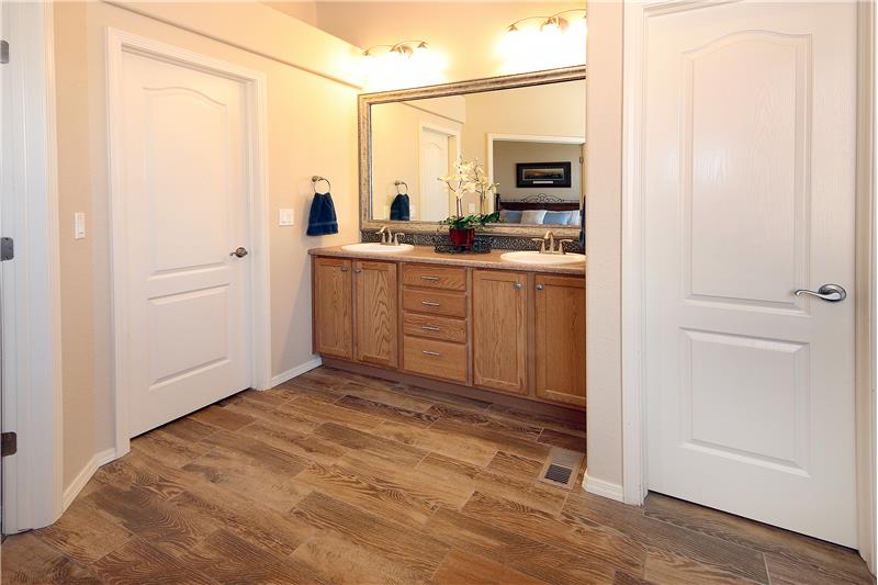 Master bathroom with comfort height counter and large walk-in closet