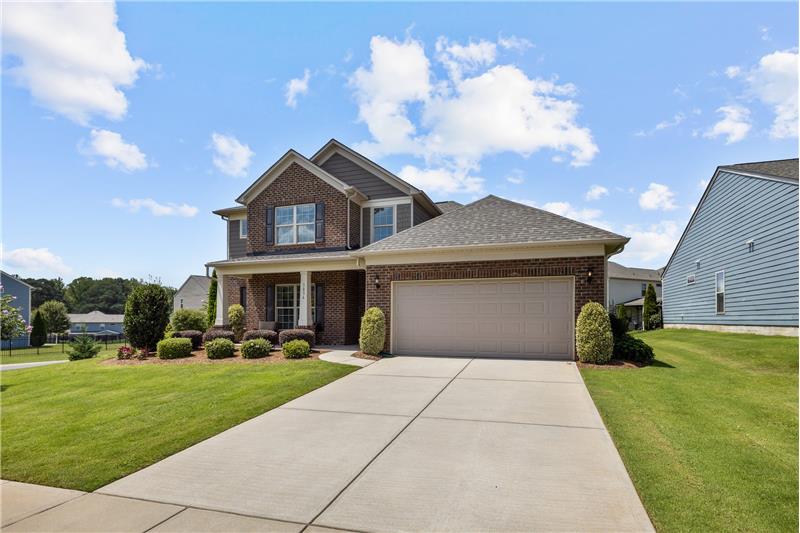 Wide driveway provides additional parking