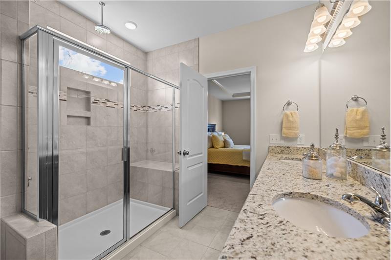 Spa-like owner's bathroom with large shower, double sink vanity