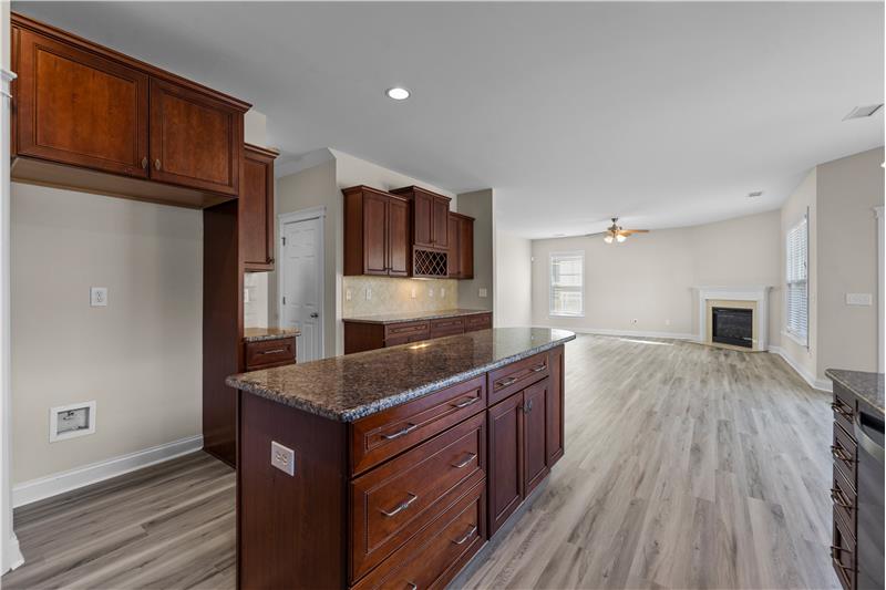 Kitchen has open sight lines to great room and breakfast area, pantry, new luxury vinyl plank floors, fresh paint.