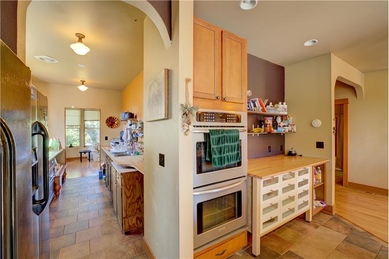 Main kitchen, with view of 2nd main floor kitchen