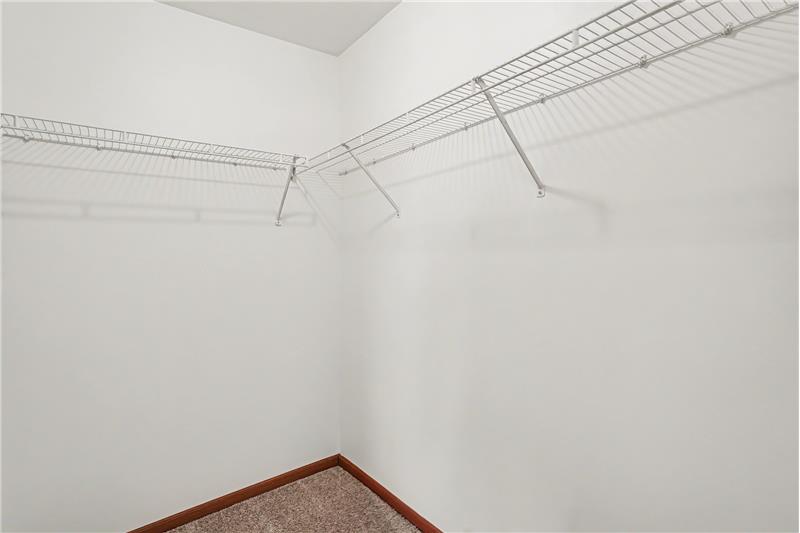 Walk in closet primary bedroom
