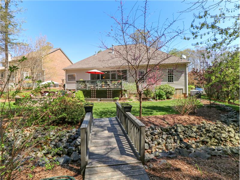 Bridge to cross rock-lined drainage swale