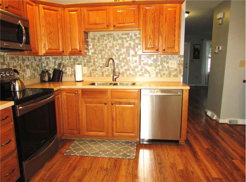 Corian countertops with tiled backsplash