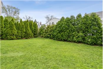 Mature evergreen hedges wrap this level, backyard in complete privacy  creating a park-like sanctuary that you can enjoy!