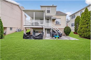 Mature evergreen hedges wrap this level, manicured backyard in complete privacy  creating a park-like sanctuary to enjoy!